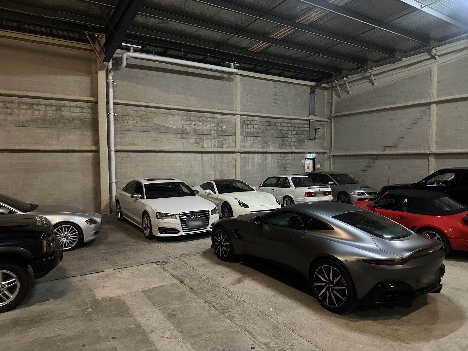 European and performance cars in the workshop: Audi, Ferrari, BMW and Aston Martin