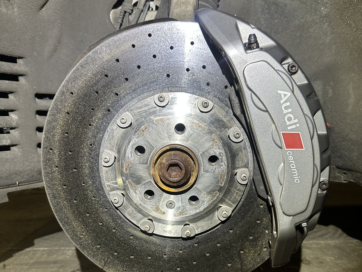 Audi carbon-ceramic brake rotor and caliper during a brake inspection